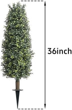 36" artificial boxwood topiary trees with ground spike shown in use