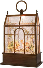 christmas snow globe lantern greenhouse water glittering globe on a desk or shelf