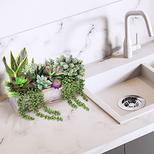assorted artificial succulents fake plants in rectangular wooden on a desk or shelf