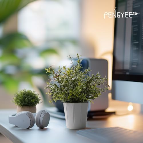 small fake plants in white pulp pot for shown in use