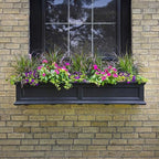 mayne fairview 60in self-watering rectangular window box planter shown in use