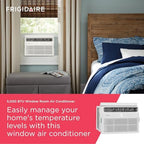 frigidaire 5,000 btu window air conditioner with remote shown in use