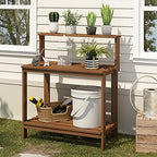 furinno tioman outdoor potting bench with storage shelf shown in use