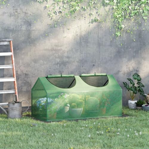 outsunny 4' x 2' x 2' portable mini shown in use