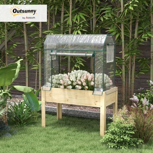 outsunny raised garden bed with greenhouse cover 45 shown in use
