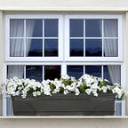 southern patio medallion windowsill platform garden planter, black shown in use