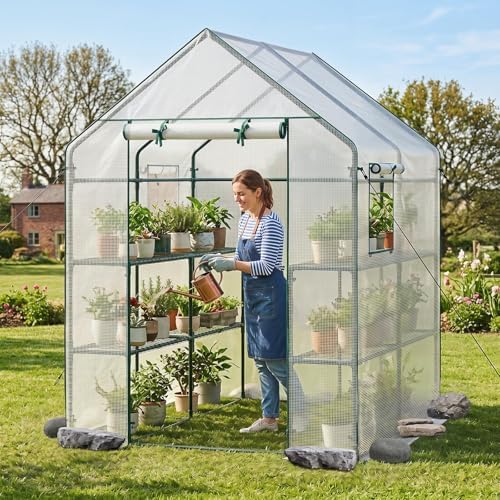 giantex walk-in greenhouse, gardening plant tent with roll-up shown in use