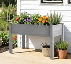 raised garden bed with legs, 48×24×30 cedar wood shown in use