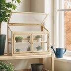 mcombo wooden cold frame garden greenhouse flower planter shown in use