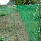 deer fence netting 5x65 ft, heavy duty plastic on a desk or shelf