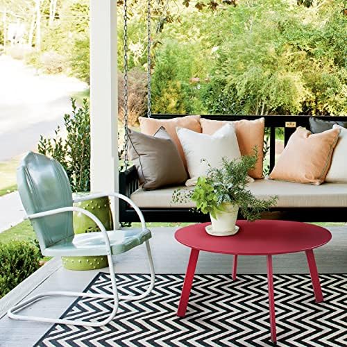 grand patio round steel patio coffee table, weather shown in use
