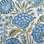 ridhi asparagus green block print ruffle pillow sham on a desk or shelf
