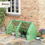 outsunny 5.9' x 3' x 3' mini greenhouse shown in use