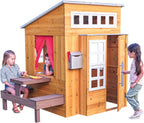 kidkraft modern outdoor wooden playhouse with picnic table shown in use
