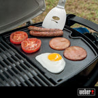 Weber® Q Griddle for Q 100/1000 Series | Porcelain‑Enameled Cast‑Iron Griddle, Superior Heat Retention, Easy‑Clean Surface, No‑Spill Rim, Grill Accessory