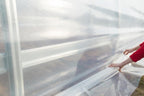 farm plastic supply - clear greenhouse plastic sheeting shown in use