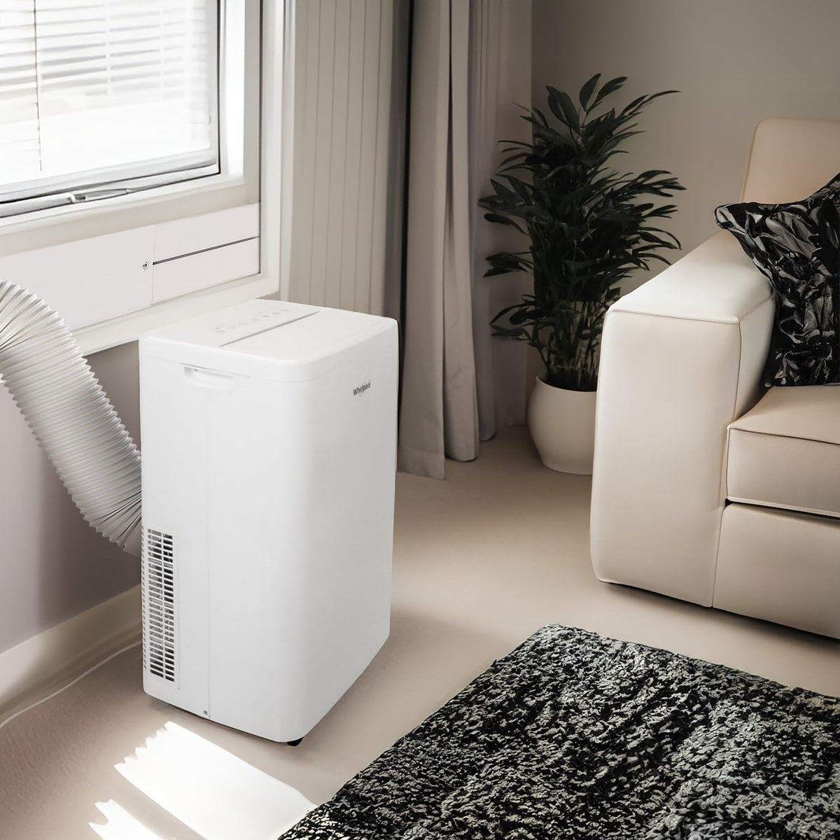 whirlpool 14,000 btu portable air conditioner with heater shown in use