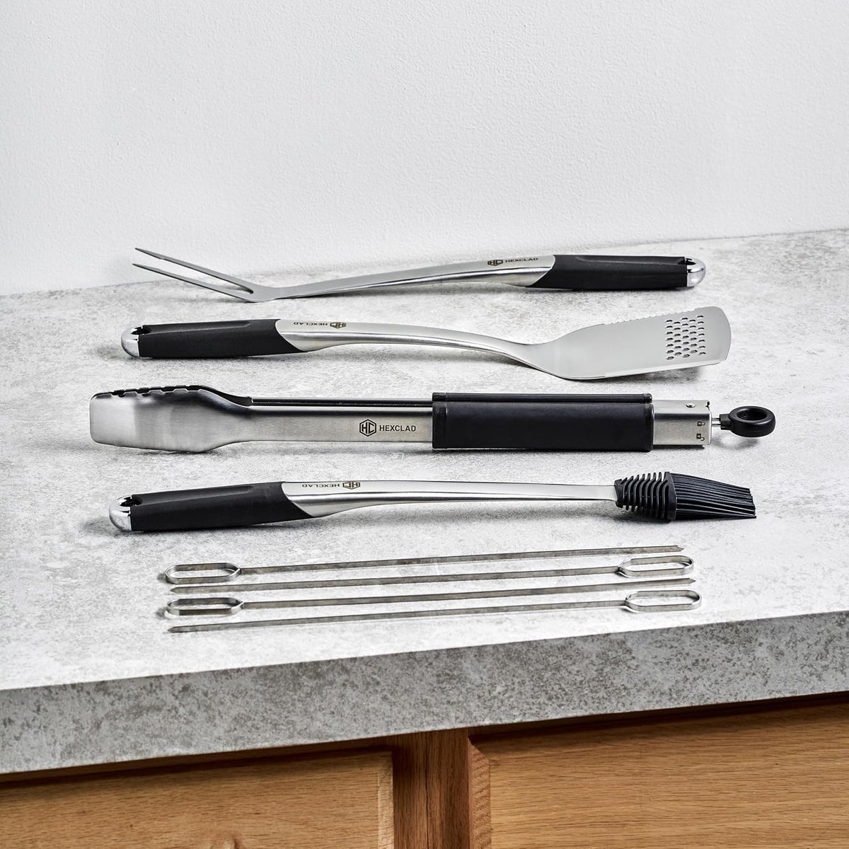 hexclad 8pc bbq tool set with spatula, tongs shown in use
