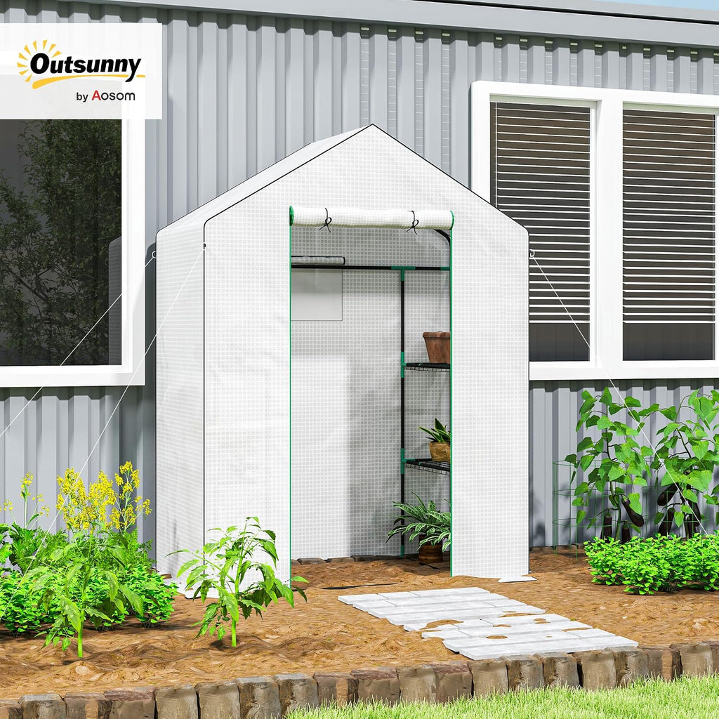 outsunny walk-in greenhouse with 3 tier 4 shelves shown in use