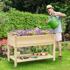 giantex raised garden bed on wheels, wood planter shown in use