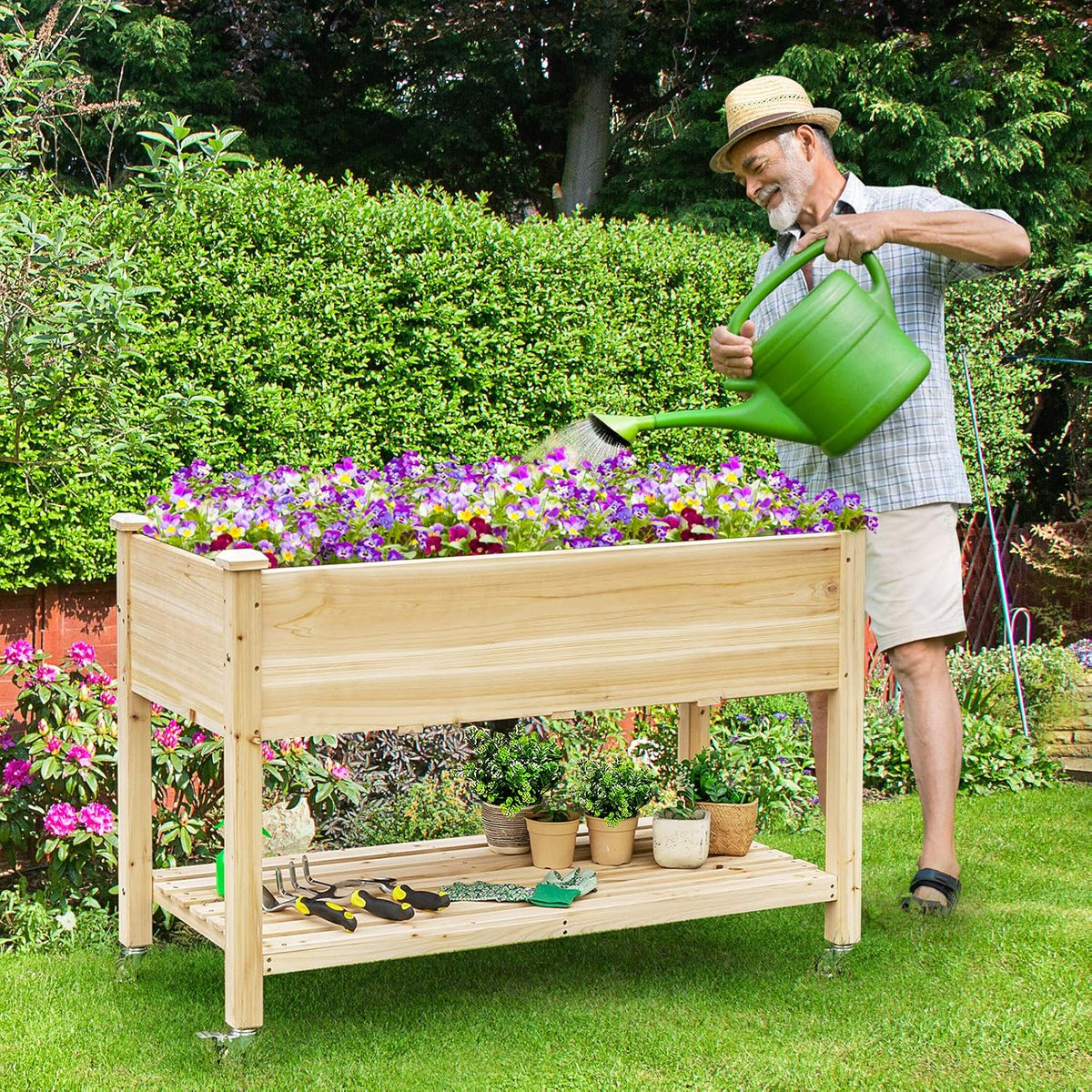 giantex raised garden bed on wheels, wood planter shown in use